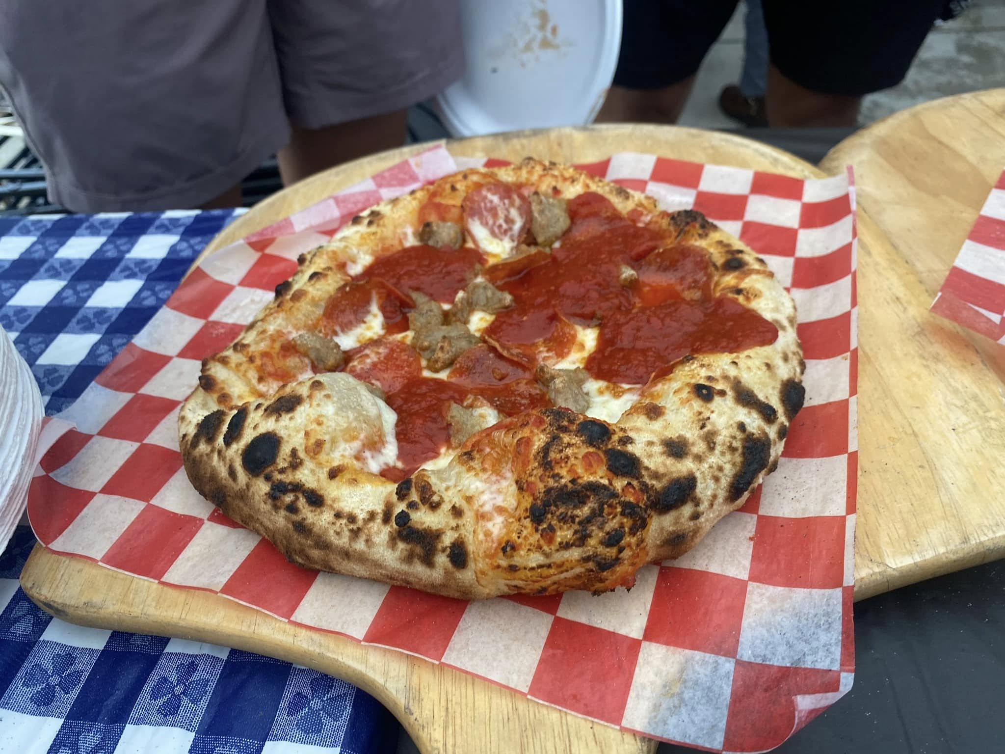 Wood-fired pizza with charred crust